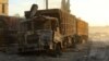 Damaged aid trucks are pictured after an airstrike on the rebel held Urm al-Kubra town, western Aleppo city, Syria Sept. 20, 2016. 