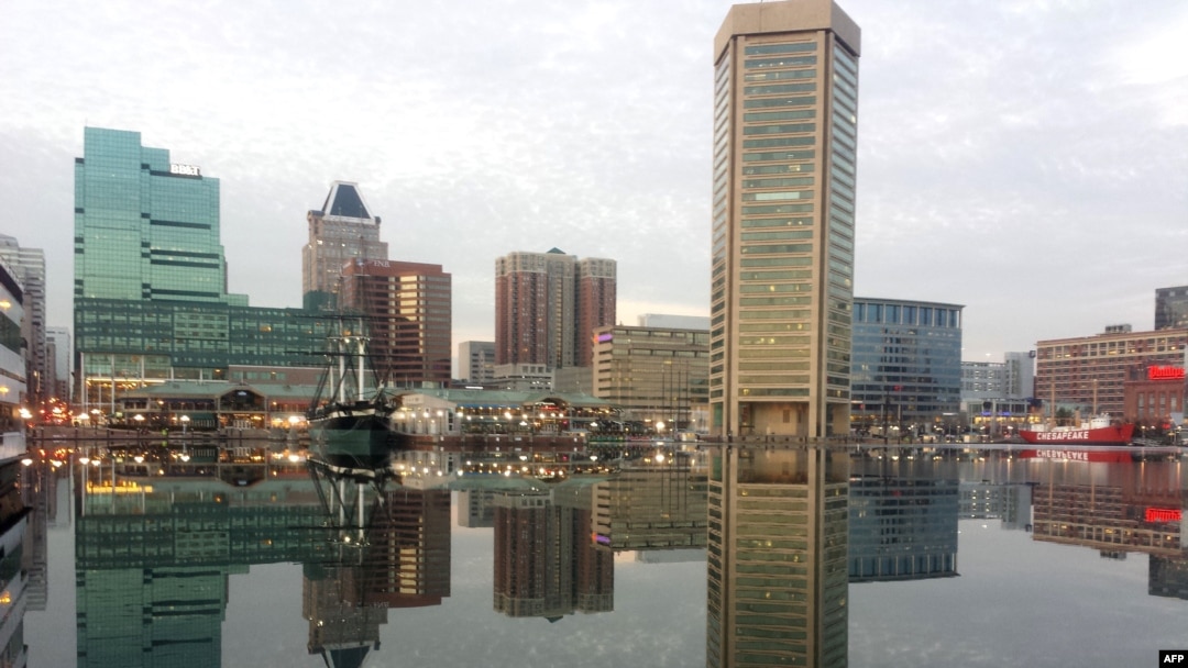 FILE - Baltimore is reflected in a still and icy Inner Harbor, Jan. 31, 2014. US President Donald Trump attacked Rep. Elijah Cummings, a Baltimore Democrat, and branded the majority black city of Baltimore an "infested mess," July 27, 2019.