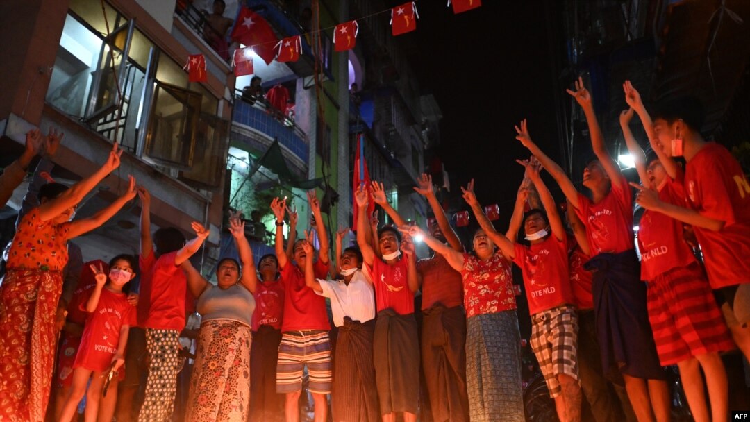 People take part in a noise campaign on the street after calls for protest against the military coup emerged on social media, in Yangon, Feb. 5, 2021. 